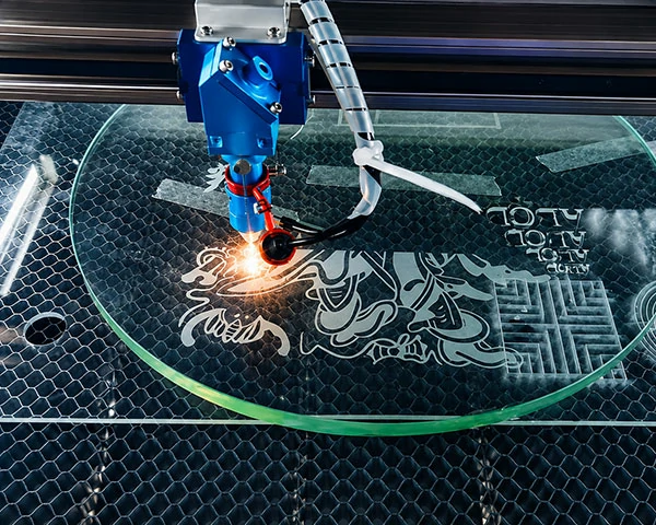 Decorative laser engraved glass with logo and pattern